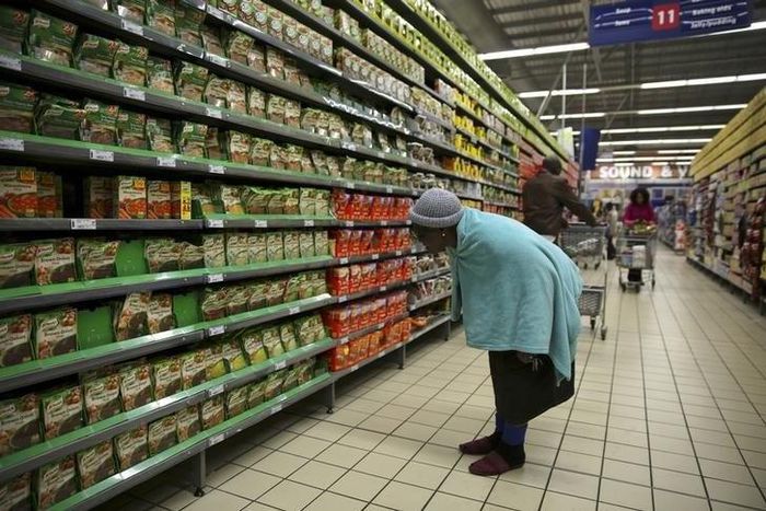 A shopper browses in a branch of South African retailer Pick n Pay at a mall in Soweto, southwest of Johannesburg August 4, 2014. REUTERS/Siphiwe Sibeko
