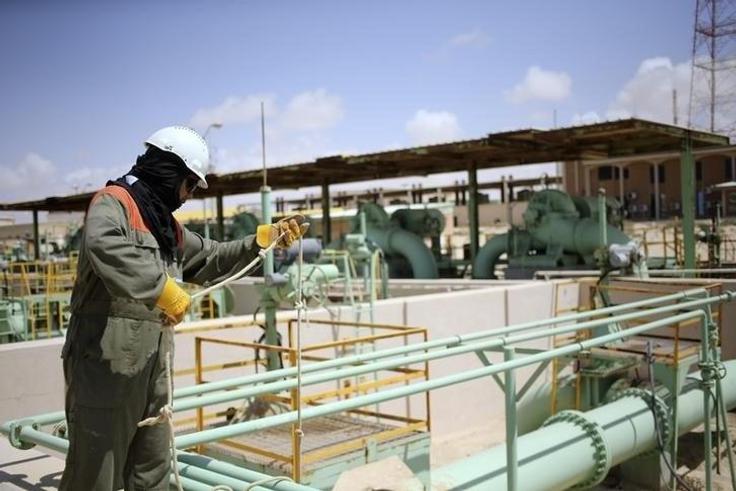 A worker maintains oil pipelines at the Zueitina oil terminal in Zueitina, west of Benghazi, in a file photo. REUTERS/Esam Omran Al-Fetori