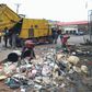 Staff of Edo State Ministry of Environment and Public Utilities evacuating refuse in Benin City during the monthly sanitation exercise in Benin City.