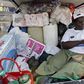 A  Zimbabwean woman  sits in the back of a truck loaded with groceries she purchased in Messina, South Africa, April 14, 2008.   REUTERS/Philimon Bulawayo