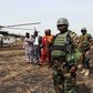 Colonel Barmou Salaou (C), commander of Niger's armed forces in the Diffa region, looks on after landing in Damasak