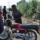 Policeman seizing an okada (illustrative purposes only)