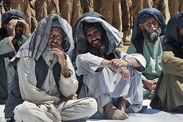The attack took place in a remote area in the eastern province of Nangarhar after ISIS jihadis intercepted at least a dozen Taliban fighters (pictured) who were fleeing a gun battle with government troops