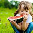 Little girl eating a watermelon