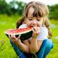 Little girl eating a watermelon