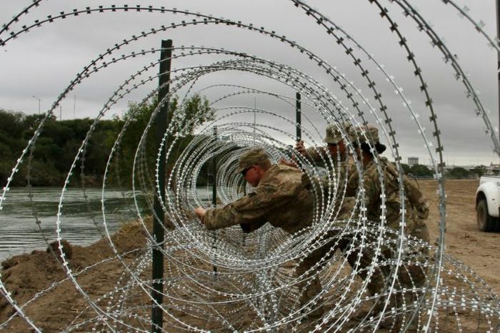 The troops' role so far has primarily been to erect miles of concertina-wire fencing along popular crossing points
