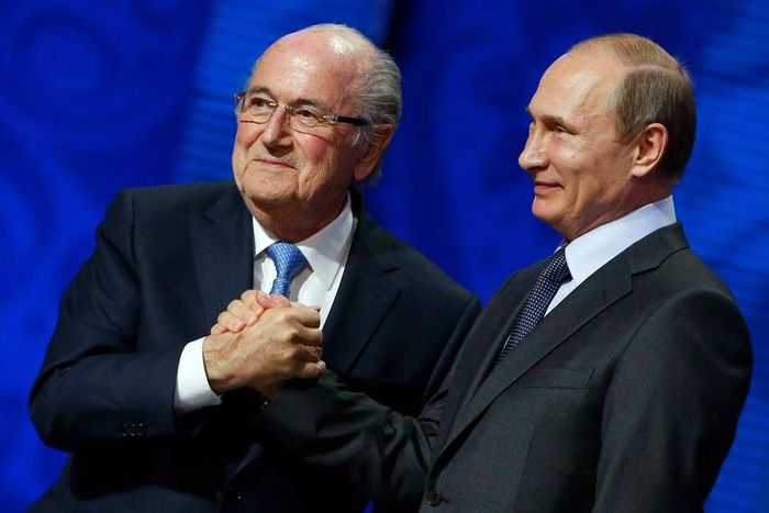 FIFA's President Sepp Blatter shakes hands with Russia's President Vladimir Putin (R) during the preliminary draw for the 2018 FIFA World Cup at Konstantin Palace in St. Petersburg, Russia July 25, 2015. REUTERS/Grigory Dukor