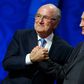 FIFA's President Sepp Blatter shakes hands with Russia's President Vladimir Putin (R) during the preliminary draw for the 2018 FIFA World Cup at Konstantin Palace in St. Petersburg, Russia July 25, 2015. REUTERS/Grigory Dukor