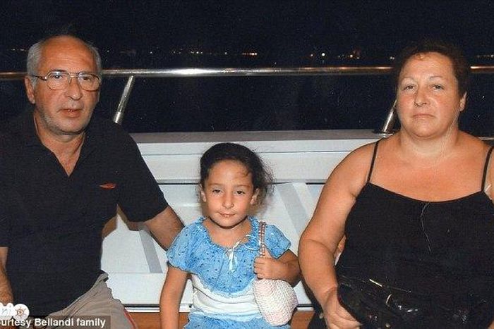 Giuseppe and Aurora Bellandi with their daughter in the middle.