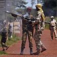 A Seleka fighter prepares a rocket propelled grenade (RPG) to be fired towards French troops in Bambari May 24, 2014.  REUTERS/Goran Tomasevic