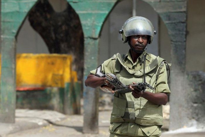A riot policeman points his rifle towards protesters during a riot in Zanzibar October 19, 2012. REUTERS/Goran Tomasevic