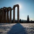 The ancient Temple of Zeus towers over an unusual blanketing of snow on Athens' Acropolis