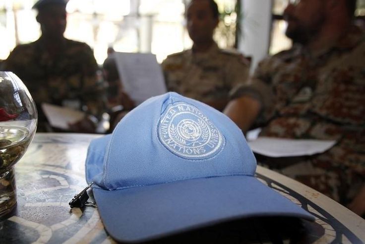 A blue United Nations cap is left near members of the U.N. observers mission in Syria, who have left their bases in the province of Homs in Central Syria, as they check their departure dates in a hotel in Damascus August 20, 2012. REUTERS/Khaled al-Har...