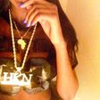 Sira Kante poses with Davido's customized HKN chain
