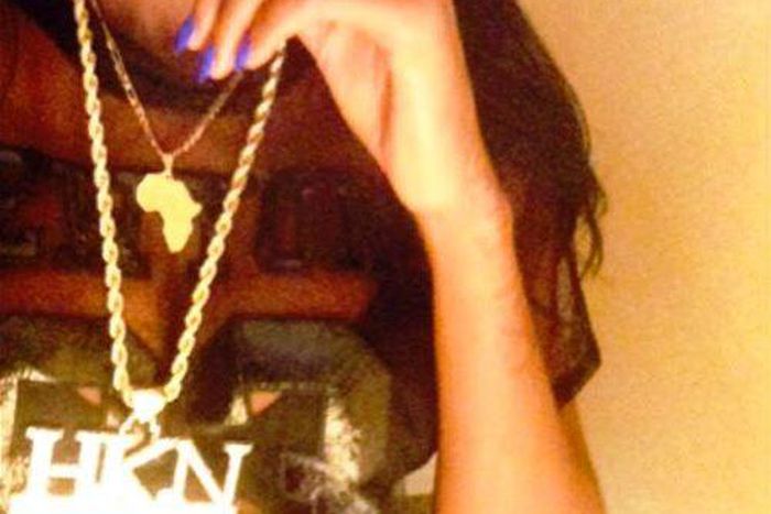 Sira Kante poses with Davido's customized HKN chain
