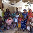 Nfamara Diawarra (C, in gray), 36, poses for a picture with his family in Segoucoura, Senegal, June 18, 2015.  REUTERS/Makini Brice