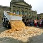 A truck dumps five cent coins in the centre of the Federal Square in Bern, Switzerland.
