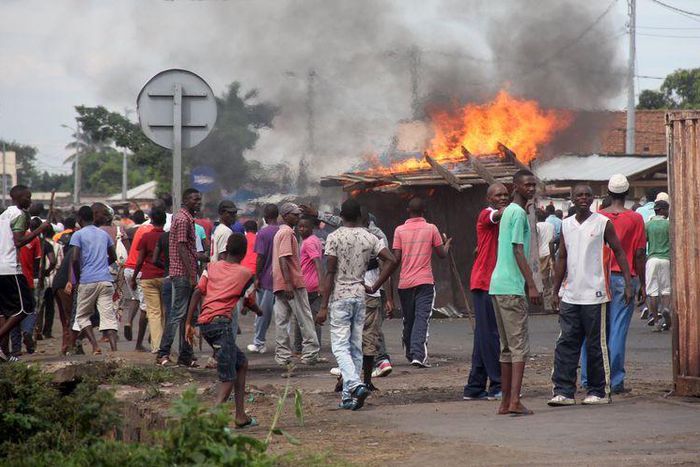 Protesters erect a barricade as they demonstrate against the ruling CNDD-FDD party's decision to allow Burundian President Pierre Nkurunziza to run for a third five-year term in office, in Bujumbura, May 7, 2015. Protesters were back on the streets of ...