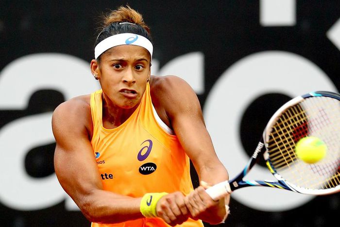 Teliana Pereira flies Brazil flag in Florianopolis