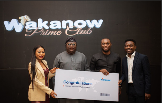 Wakanow Prime Club member beams with excitement after winning the bid for an Air France business class ticket to any destination in Europe during the lively ticket auction at the Wakanow Prime Club launch.