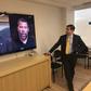 Paul Scharre of the Center for a New American Security looks at a "deepfake" video of former US President Barack Obama manipulated to show him speaking words from actor Jordan Peele on January 24, 2019, in Washington