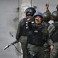 Soldiers from Venezuela's National Guard fired tear gas at protesters near the Cotiza command post taken over by rebel troops aiming to overthrow President Nicolas Maduro on January 21, 2019