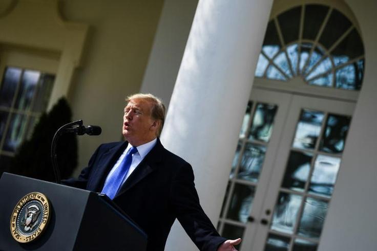 US President Donald Trump gestures as he delivers remarks in the Rose Garden at the White House in Washington, DC on February 15, 2019