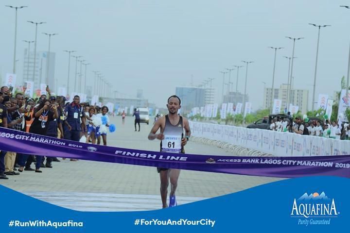 Sintayehu Legese breasting the tape at the finish of the 42km race