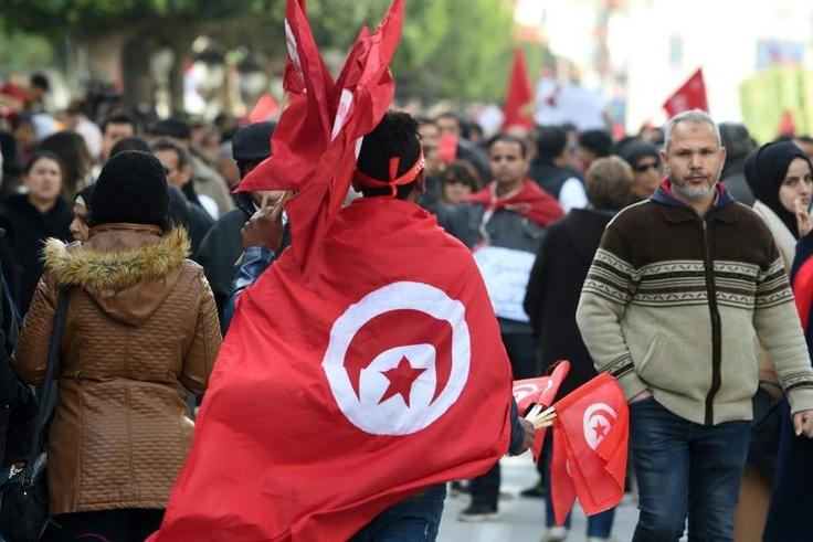 Tunisians rally in Tunis to mark the eighth anniversary of the 2011 revolution that toppled their longtime dictator on January 14, 2019