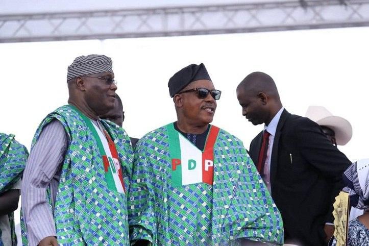 Former vice president, Atiku Abubakar with the PDP's national chairman, Uche Secondus