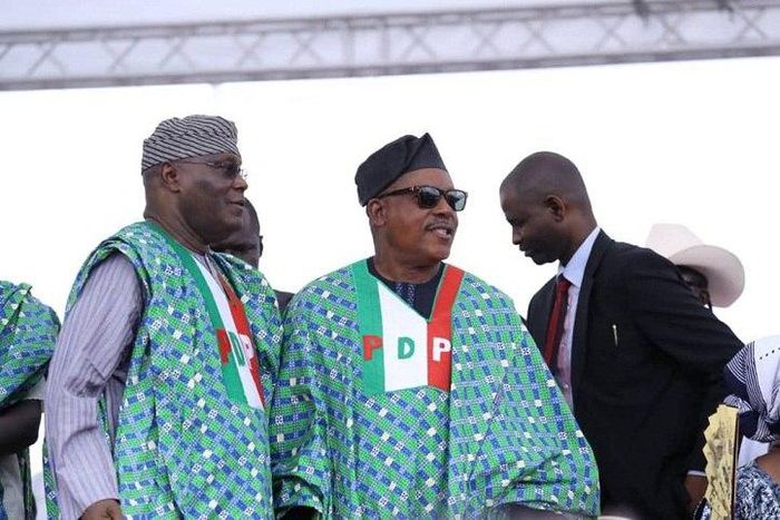 Former vice president, Atiku Abubakar with the PDP's national chairman, Uche Secondus