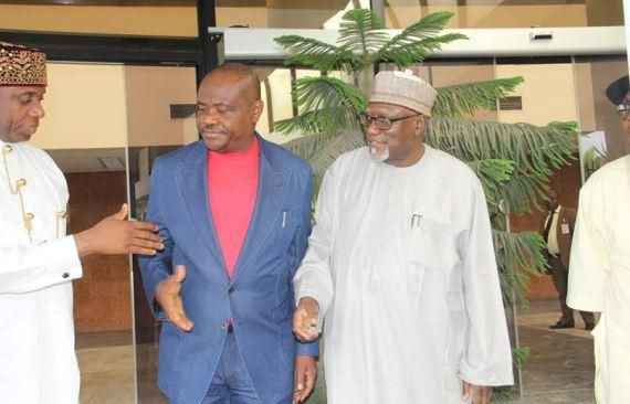 Nyesom Wike and Rotimi Amaechi exchange handshake after the peace meeting on Tuesday, July 26.