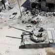 Syrian soldiers advance in an area on the eastern outskirts of Douma on April 8, 2018
