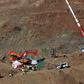 A crane lifts a cage January 24, 2019 that will be used to lower the miners who will go on with the manual rescue works at the site where a child fell down a well in Totalan, southern Spain, on January 24, 2019