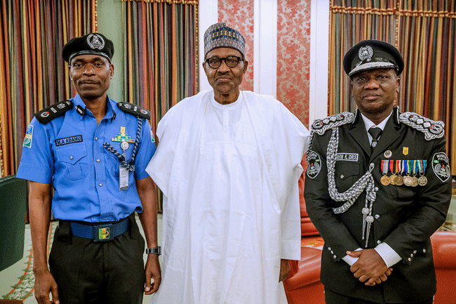 From L-R The new Inspector-General of Police (IGP), Mohammad Adamu, President Buhari and the outgoing IGP, Ibrahim Idris (Channels TV)