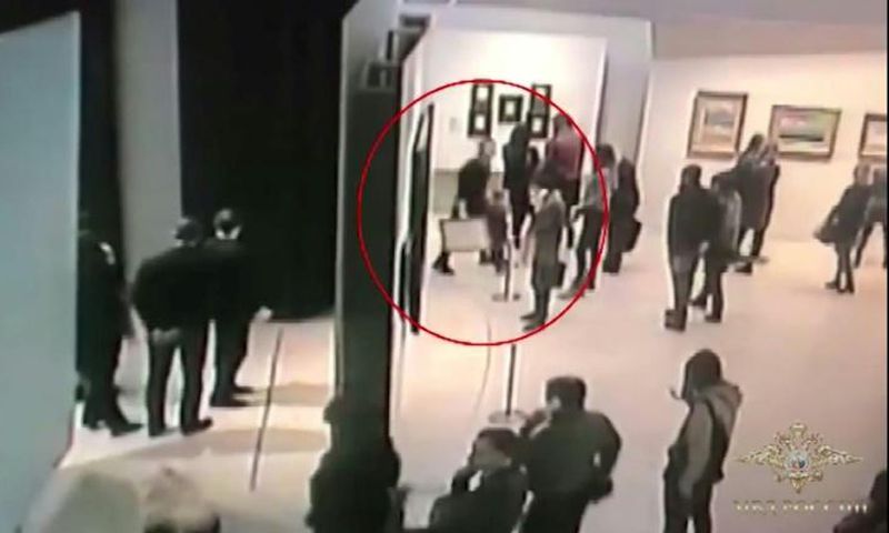 An image grab taken from a video footage released by the Russian Interior Ministry shows a man, stealing a painting by Arkhip Kuindzh at Moscow's Tretyakov Gallery