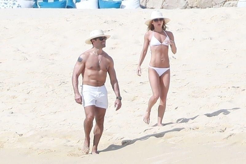 Kelly Ripa And Mark Consuelos Rock White Swimsuits