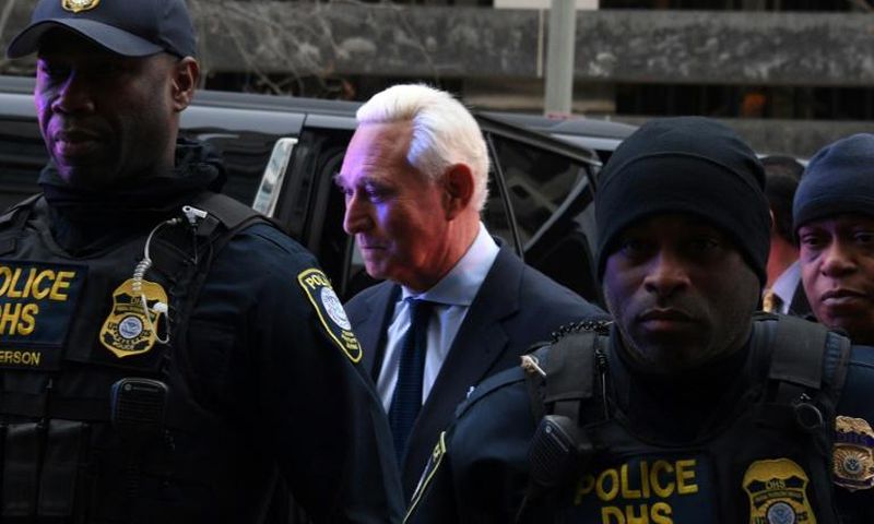 Longtime Donald Trump adviser Roger Stone arrives for his arraignment on charges of lying to Congress