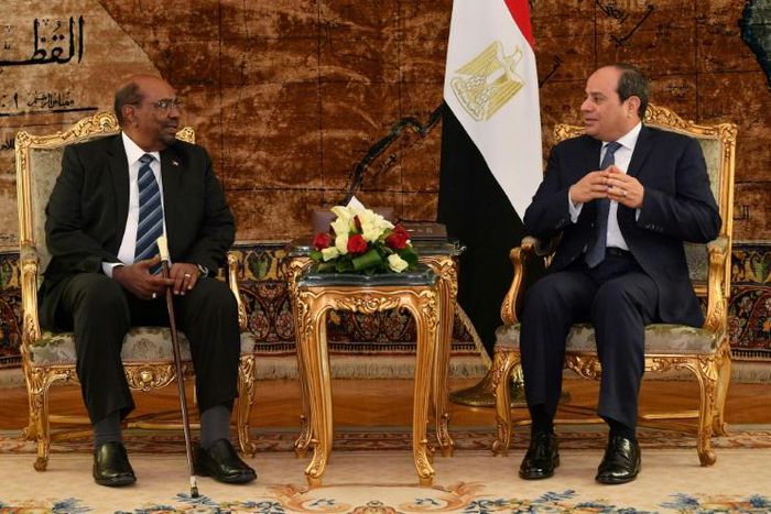 A handout picture released by the Egyptian presidency shows Egyptian President Abdel Fattah al-Sisi meeting with his Sudanese counterpart Omar al-Bashir in Cairo