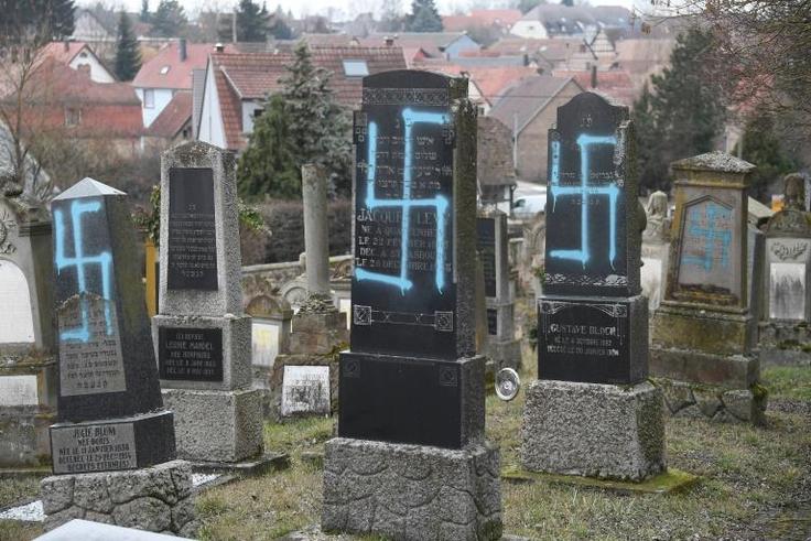 Swastikas were discovered on dozens of graves at the Jewish cemetery in Quatzenheim, eastern France, on Tuesday