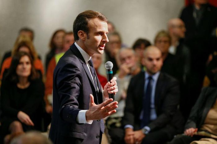 President Emmanuel Macron answering questions from residents during a surprise appearance at a debate in Bourg-de-Peage, southeast France, on Thursday