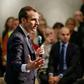 President Emmanuel Macron answering questions from residents during a surprise appearance at a debate in Bourg-de-Peage, southeast France, on Thursday