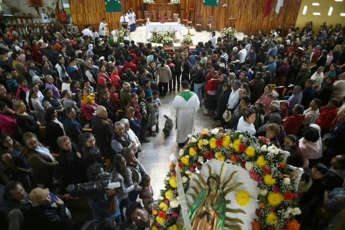 Relatives of three of the people killed in a massive blaze triggered by a leaky pipeline in Tlahuelilpan, Mexico attend their funeral on January 20, 2019