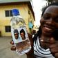 Water works? Bottled water bearing the image of Nigeria's President Mohammadu Buhari and his vice president ahead of Saturday's rescheduled elections