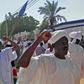 Sudanese men shout slogans during an anti-government protest following Friday noon prayers on January 18, 2019 outside a mosque in Khartoum's twin city Omdurman