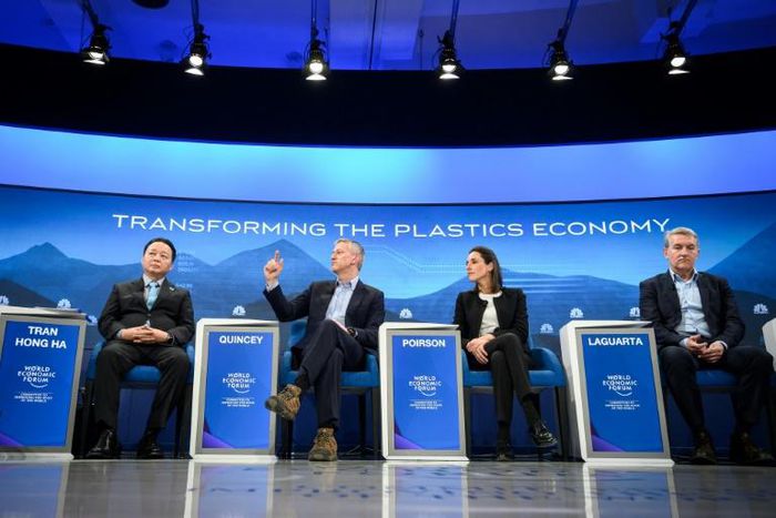 Coca-Cola CEO James Quincey (2L) and PepsiCO CEO Ramon Laguarta (R) participate in a panel discussion on reducing plastic waste during a session of the World Economic Forum in Davos, Switzerland