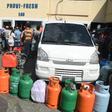 People wait to fill gas cylinders at a station in the Haitian Capital Port-au-Prince