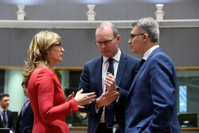 Irish Foreign Minister Simon Coveney (C) talks with Bulgarian Foreign Minister Ekaterina Zaharieva (L) and Malta Foreign Minister Carmelo Abela (R) during a Foreign Affairs Council at the EU headquarters in Brussels on February 18, 2019