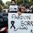 Moroccans attend a vigil for the two murdered Scandinavian women, outside the Danish embassy in Rabat on December 22, 2018