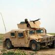 A fighter with the US-backed Syrian Democratic Forces (SDF) sits atop a military vehicle during an operation to expel Islamic State group (IS) jihadists from their last pocket, the Baghouz area in the eastern Syrian province of Deir Ezzor on February 1...